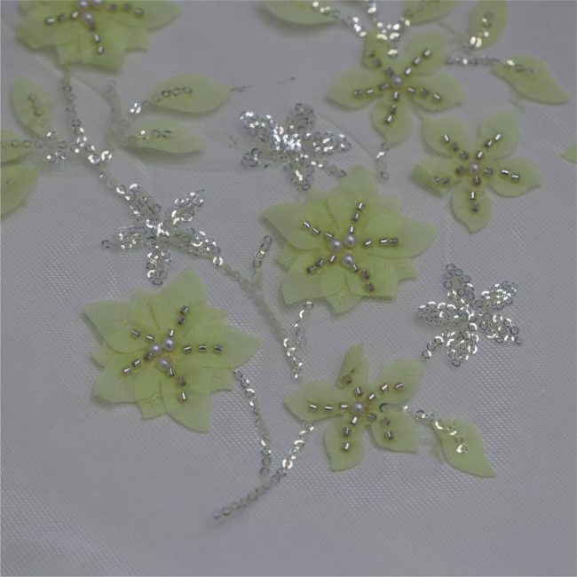 Elegant Floral Embroidered Fabric with Sparkling Accents - Image 13