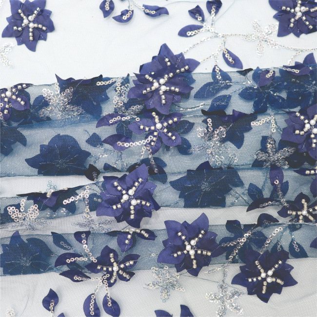 Elegant Floral Embroidered Fabric with Sparkling Accents - Image 9