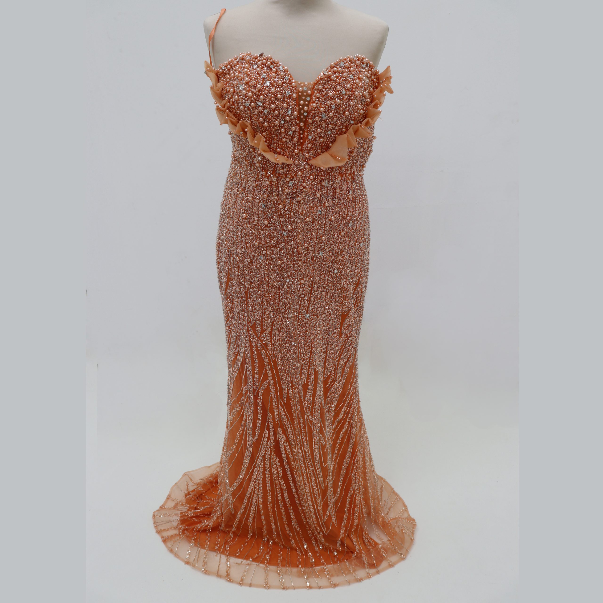 The Radiant Sunset Gown with intricate beadwork and shimmering embellishments